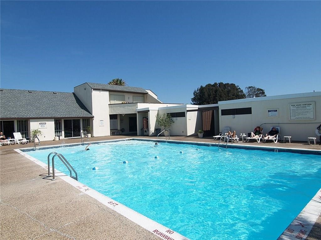 14300 Aloha Street, Unit 231 Corpus Christi, TX 78418 - Photo 36 of 37 a front view of a house with garden