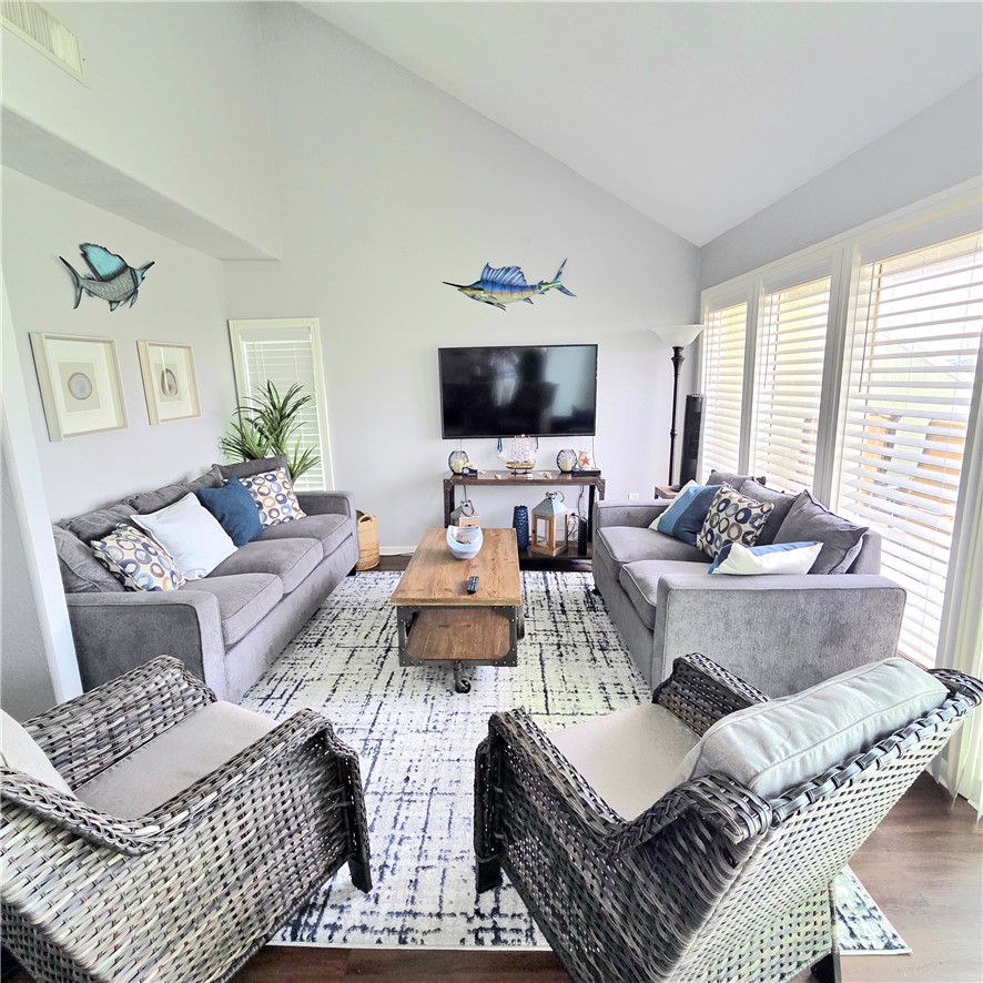 14300 Aloha Street, Unit 231 Corpus Christi, TX 78418 - Photo 4 of 37 a living room with furniture and a flat screen tv