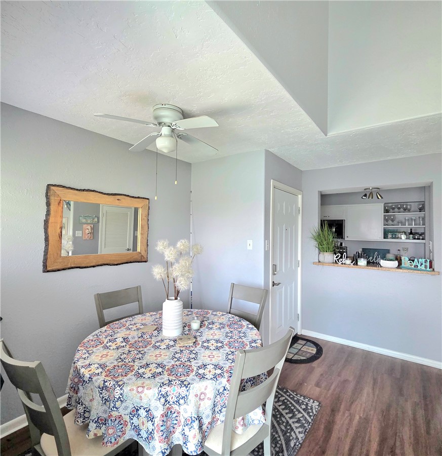 14300 Aloha Street, Unit 231 Corpus Christi, TX 78418 - Photo 6 of 37 a bedroom with furniture and a chandelier