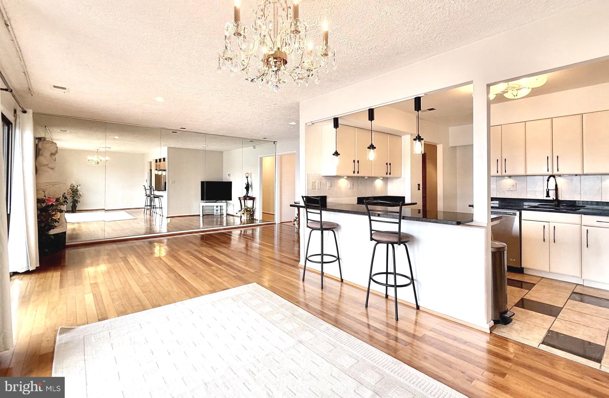 532 Riviera Drive, Unit 532B Joppa, MD 21085 - Photo 1 of 43 a living room with stainless steel appliances kitchen island granite countertop furniture and a wooden floor