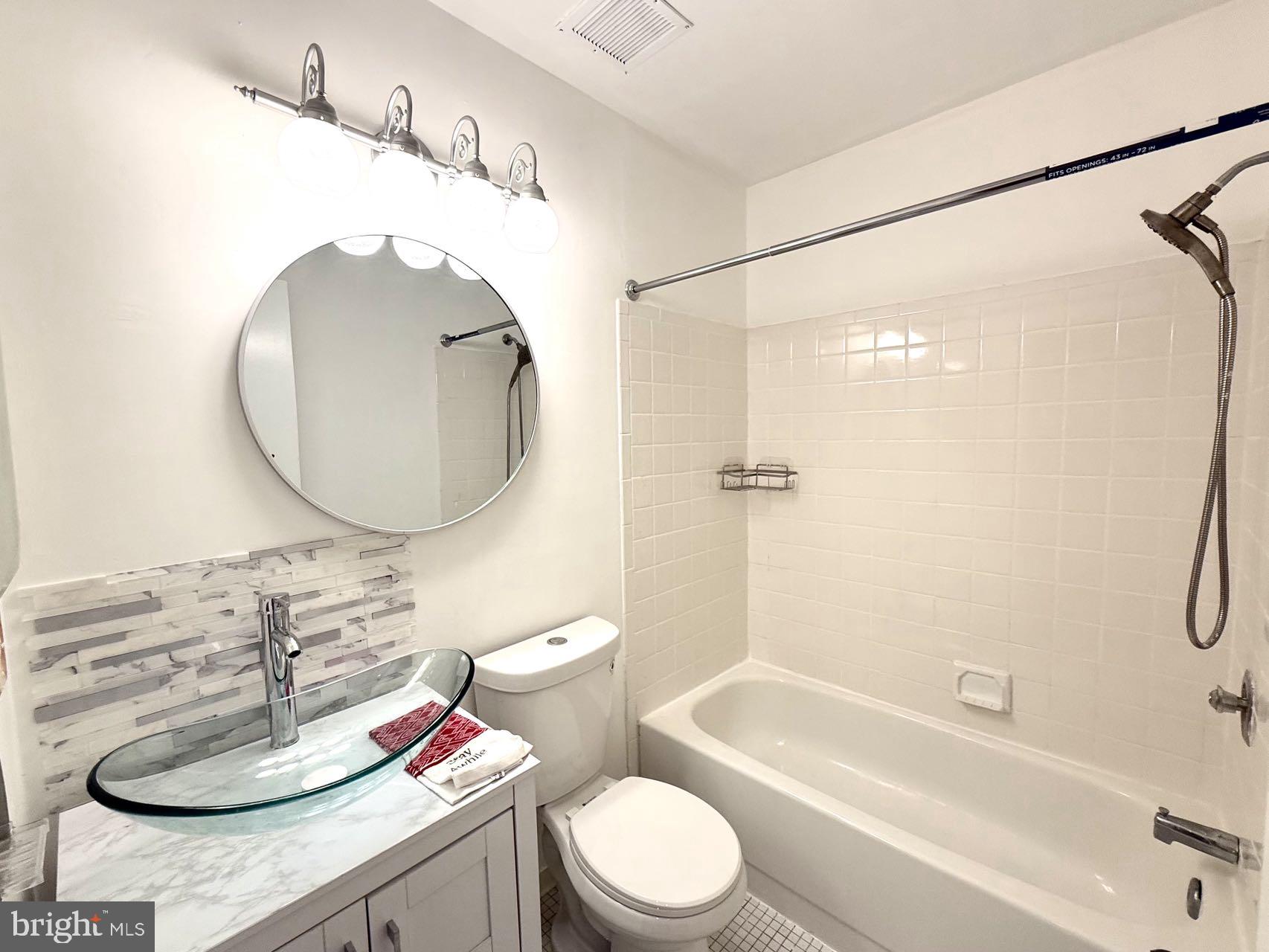 532 Riviera Drive, Unit 532B Joppa, MD 21085 - Photo 14 of 43 a bathroom with a sink a toilet and a mirror