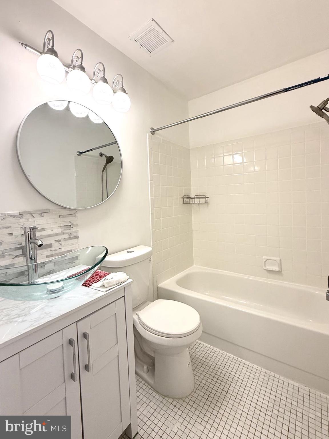 532 Riviera Drive, Unit 532B Joppa, MD 21085 - Photo 15 of 43 a bathroom with a sink a toilet and a mirror
