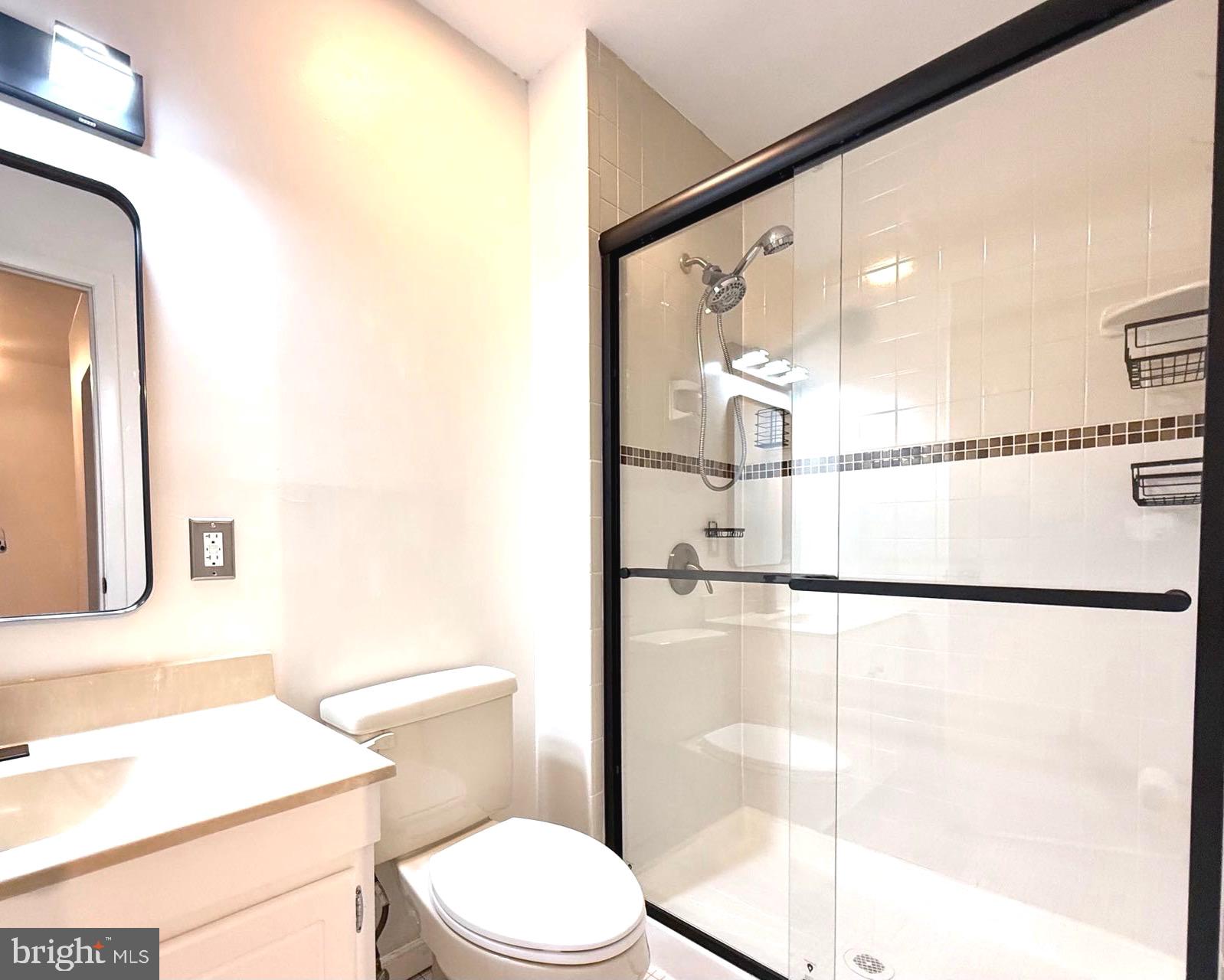 532 Riviera Drive, Unit 532B Joppa, MD 21085 - Photo 20 of 43 a bathroom with a shower toilet and sink