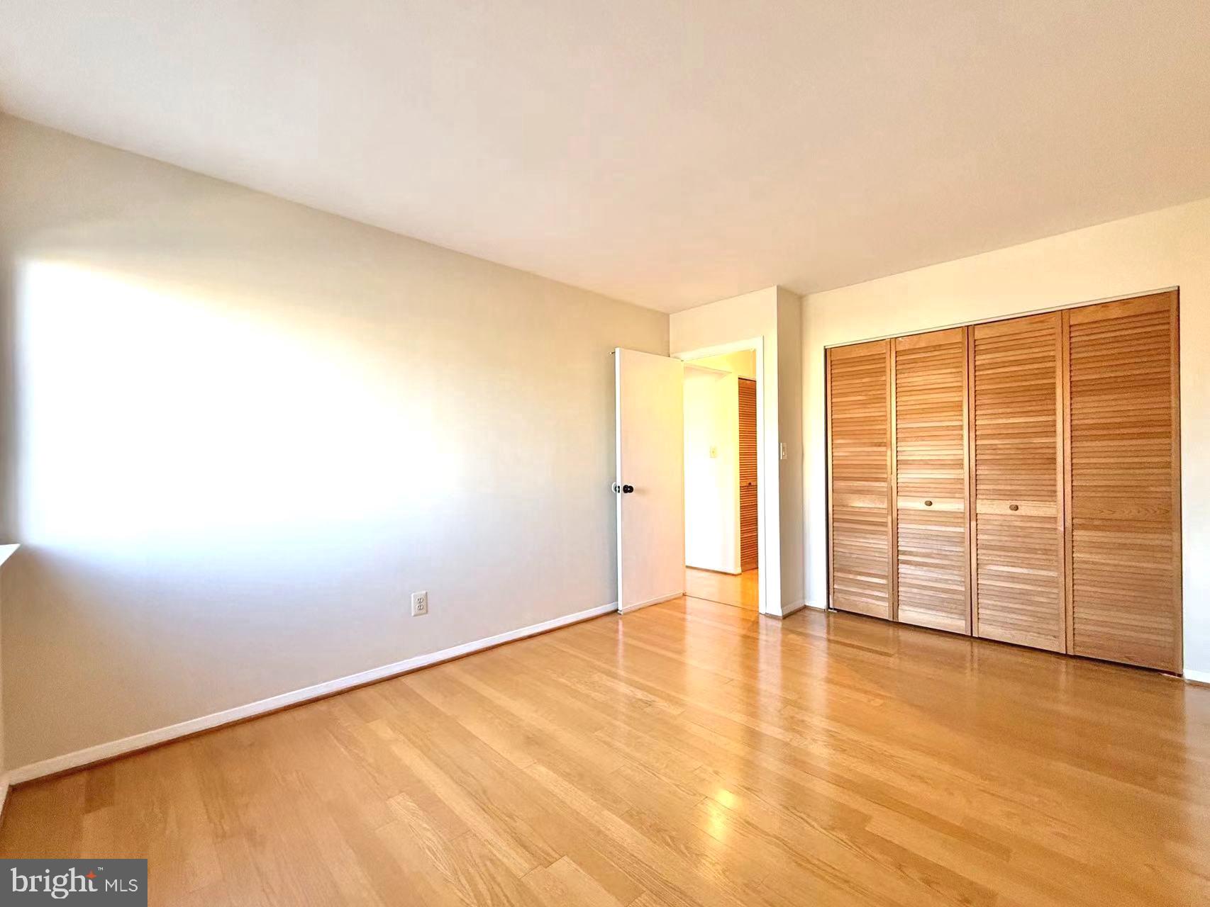 532 Riviera Drive, Unit 532B Joppa, MD 21085 - Photo 22 of 44 an empty room with wooden floor and windows
