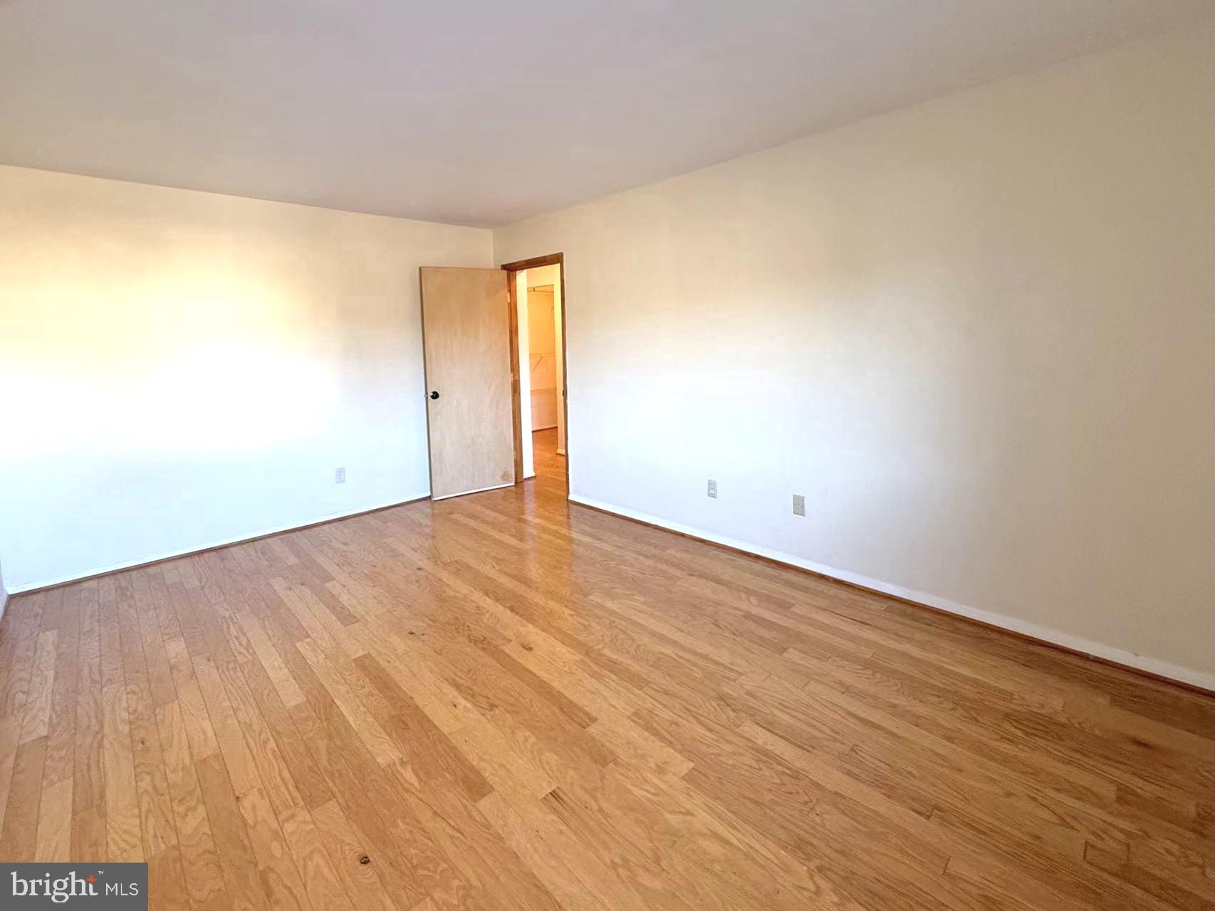 532 Riviera Drive, Unit 532B Joppa, MD 21085 - Photo 23 of 43 a view of an empty room and wooden floor