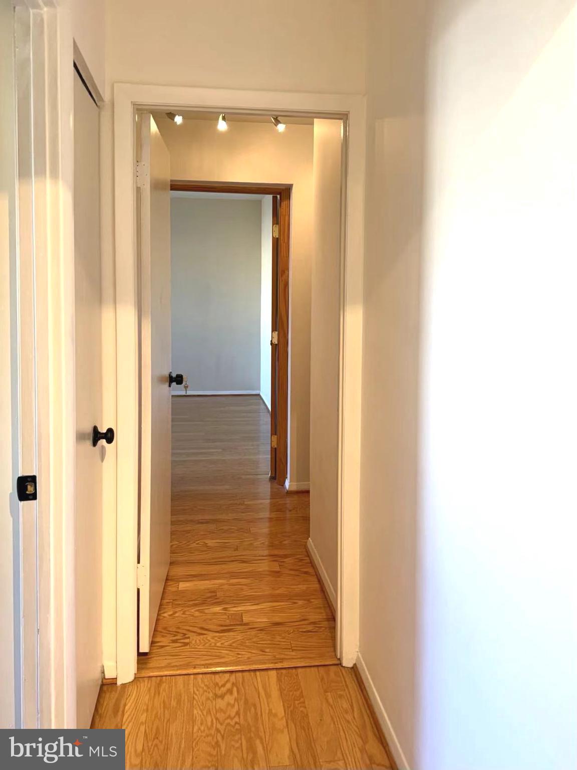 532 Riviera Drive, Unit 532B Joppa, MD 21085 - Photo 26 of 44 a view of a hallway with wooden floor