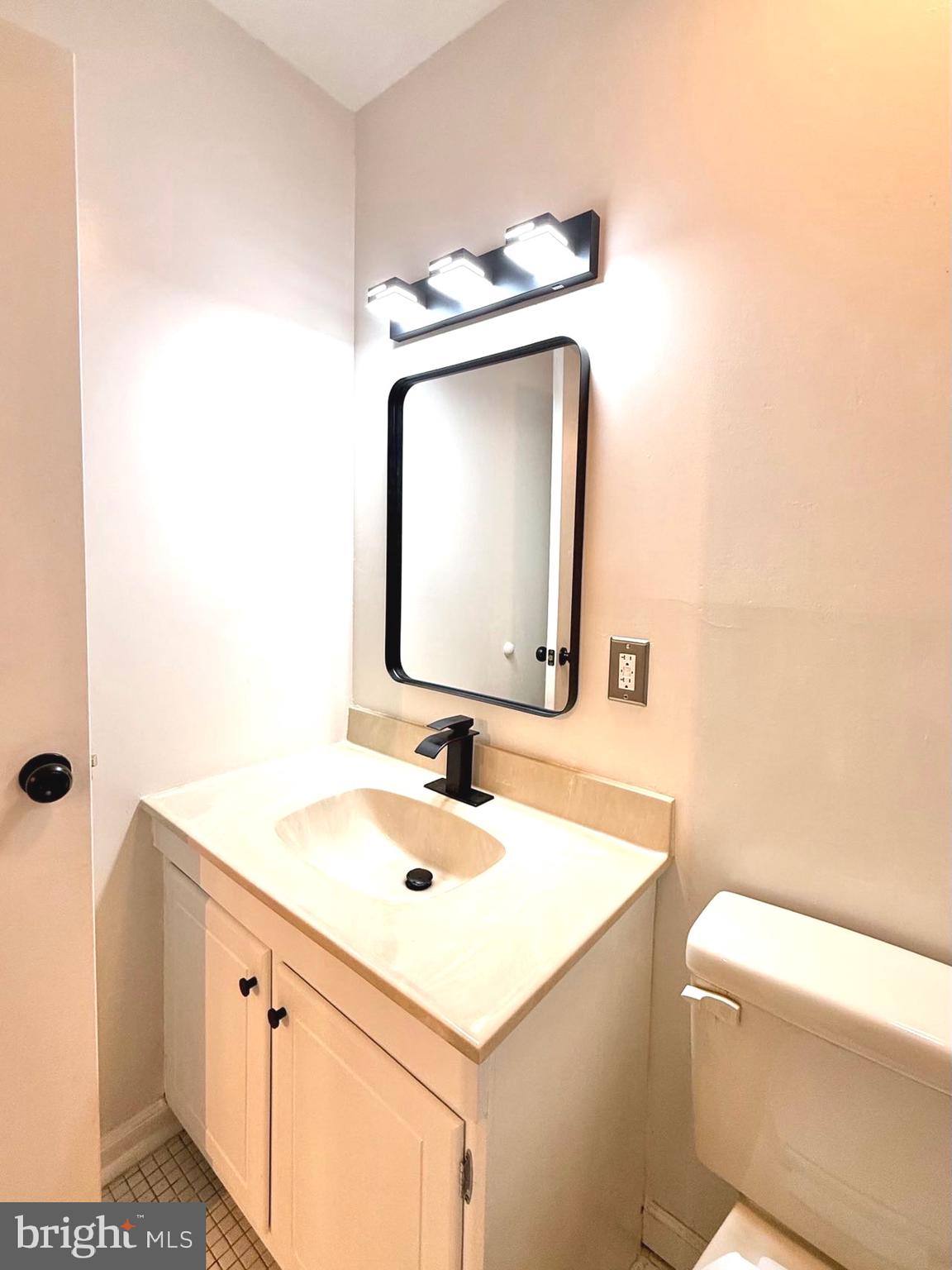 532 Riviera Drive, Unit 532B Joppa, MD 21085 - Photo 28 of 43 a bathroom with a sink toilet and mirror