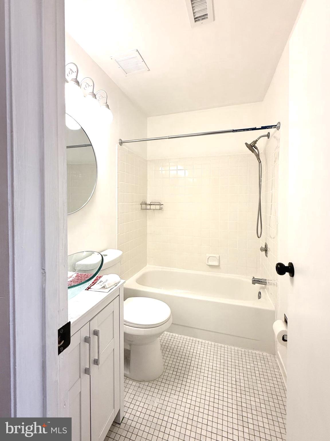 532 Riviera Drive, Unit 532B Joppa, MD 21085 - Photo 30 of 44 a bathroom with a granite countertop sink toilet and shower