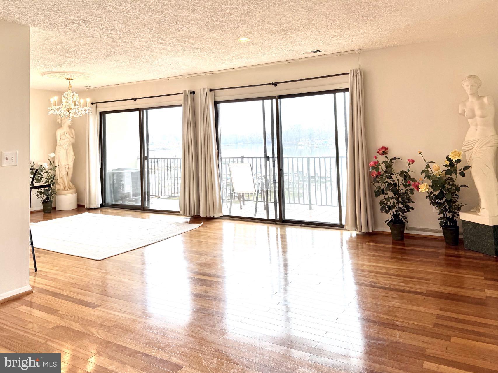 532 Riviera Drive, Unit 532B Joppa, MD 21085 - Photo 3 of 44 a view of an empty room with wooden floor and a window