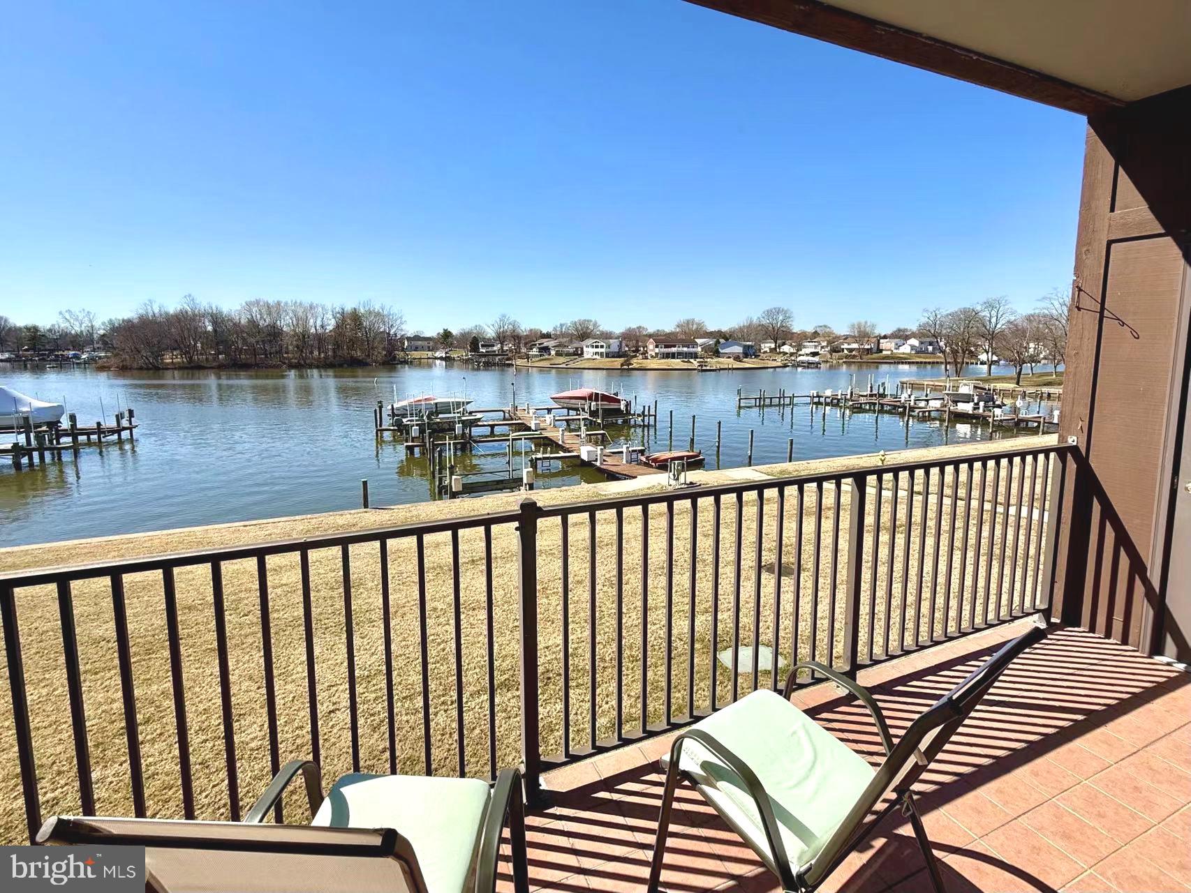 532 Riviera Drive, Unit 532B Joppa, MD 21085 - Photo 37 of 43 a view of a balcony with wooden floor and lake view