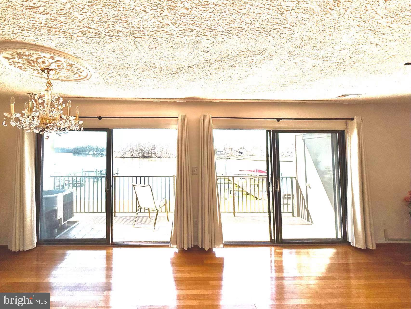 532 Riviera Drive, Unit 532B Joppa, MD 21085 - Photo 7 of 43 a view of empty room with wooden floor and fan