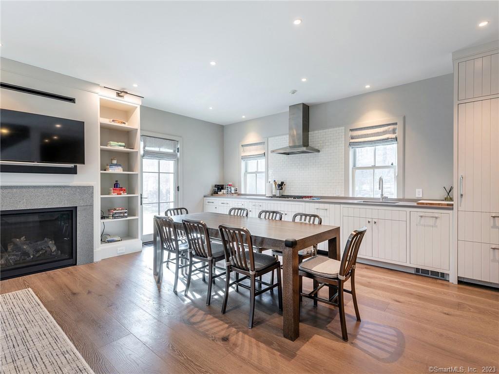 126 River Road Washington, CT 06794 - Photo 12 of 32 a dining room with furniture window and wooden floor