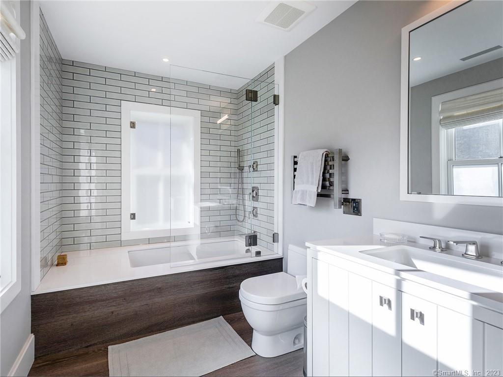 126 River Road Washington, CT 06794 - Photo 20 of 32 a bathroom with a granite countertop toilet sink and bathtub