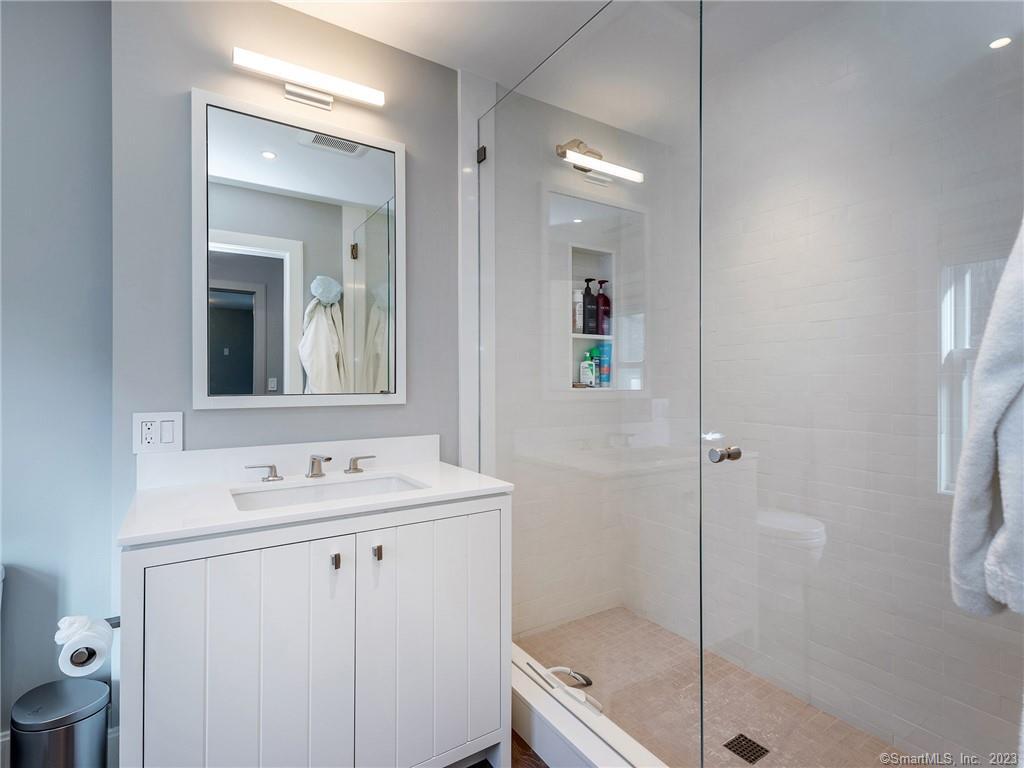 126 River Road Washington, CT 06794 - Photo 23 of 32 a bathroom with a sink a toilet and shower
