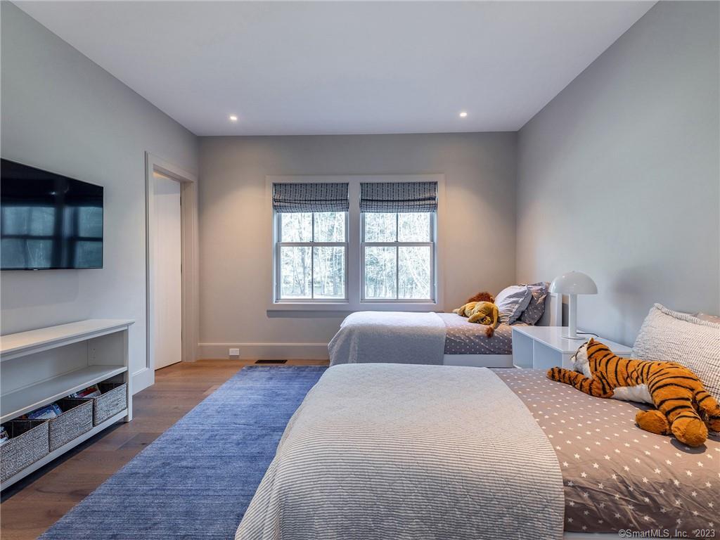126 River Road Washington, CT 06794 - Photo 25 of 32 a bedroom with two beds and a window