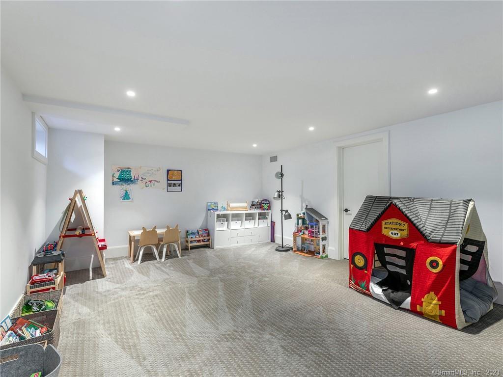 126 River Road Washington, CT 06794 - Photo 29 of 32 a living room with furniture a air conditioner and a table