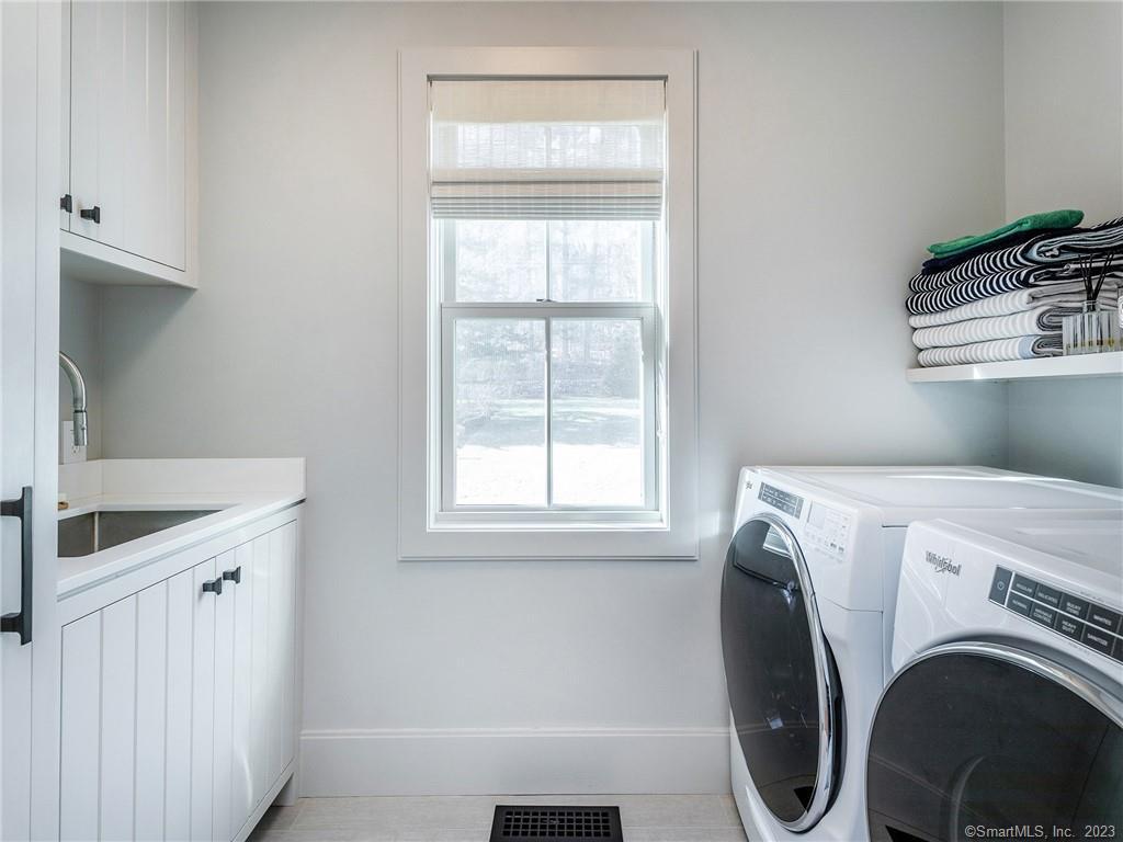 126 River Road Washington, CT 06794 - Photo 30 of 32 a utility room with dryer and washer