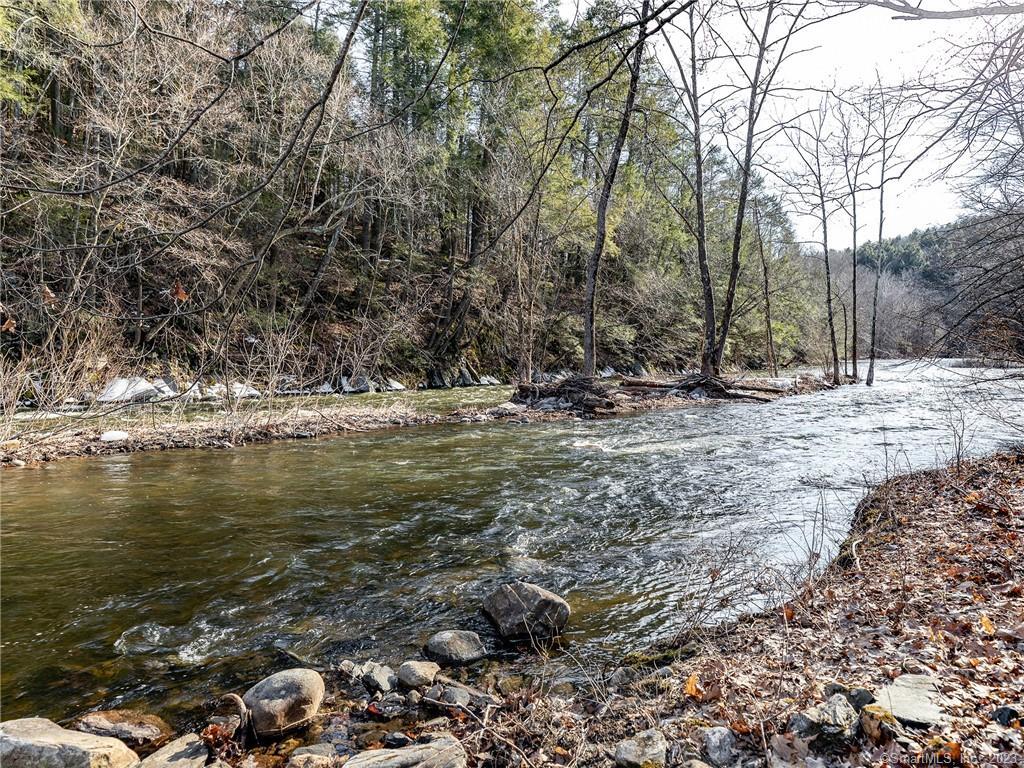 126 River Road Washington, CT 06794 - Photo 32 of 32 a view of water with trees in the background