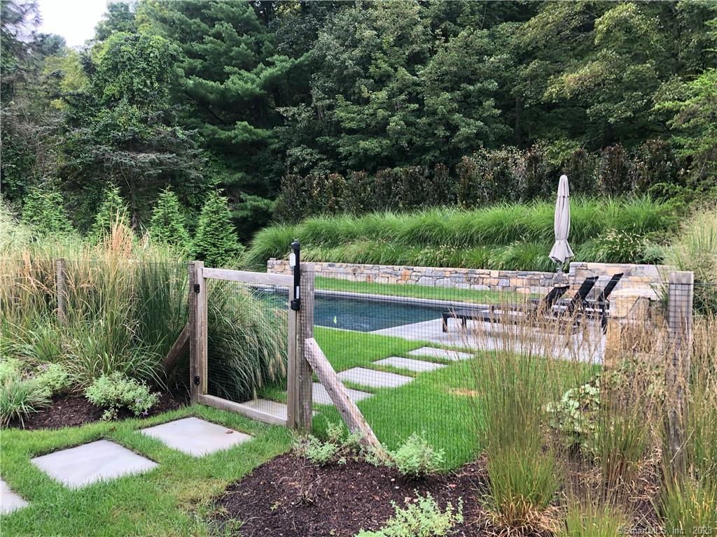 126 River Road Washington, CT 06794 - Photo 7 of 32 a view of backyard with swimming pool and seating space
