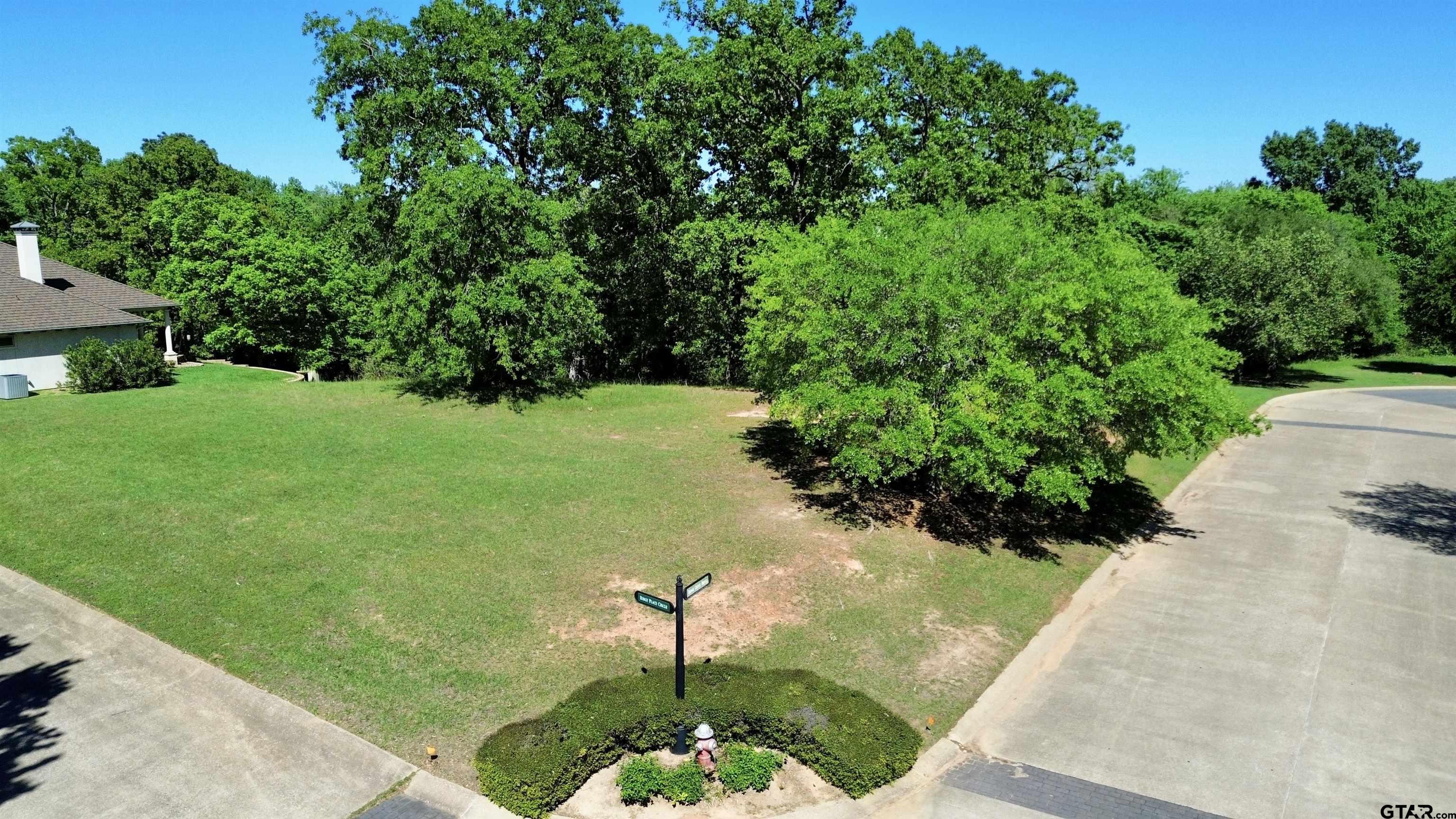 605 Ridgecreek Drive Tyler, TX 75703 - Photo 2 of 4 a view of a garden with a fountain