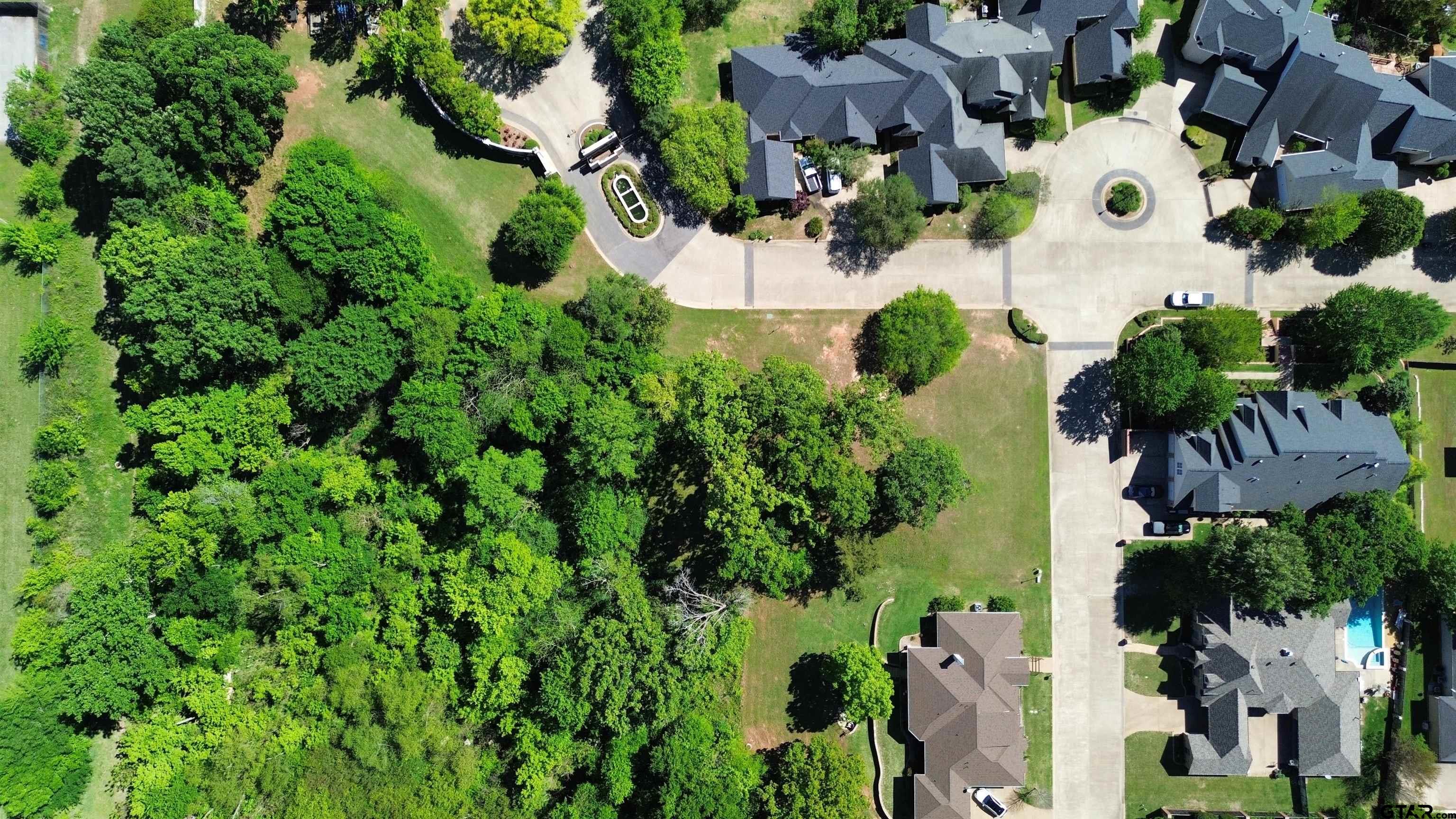 605 Ridgecreek Drive Tyler, TX 75703 - Photo 3 of 4 an aerial view of residential house with outdoor space and trees all around