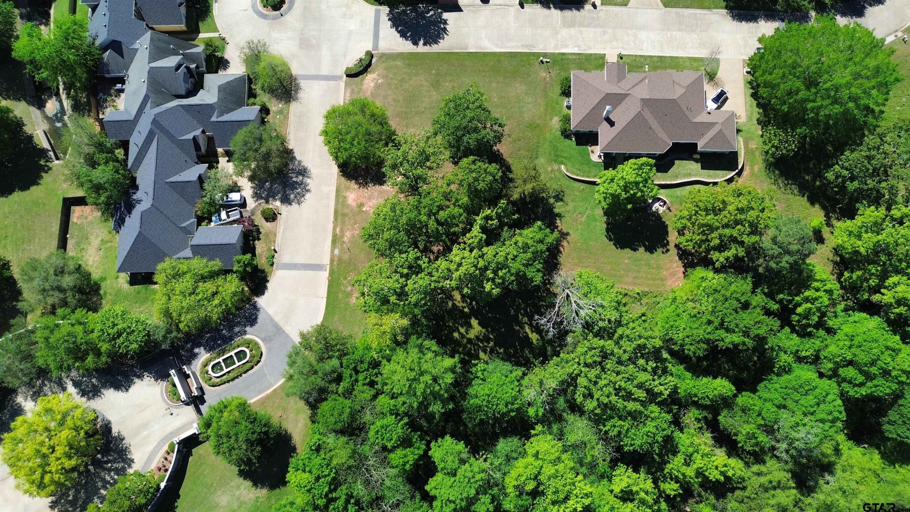 605 Ridgecreek Drive Tyler, TX 75703 - Photo 4 of 4 an aerial view of residential house with outdoor space and trees all around