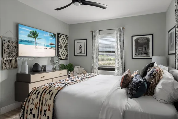 a bedroom with a bed and glass door