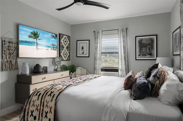 a bedroom with a bed and glass door