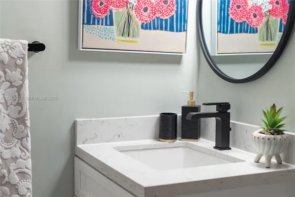 a bathroom with a sink and a mirror