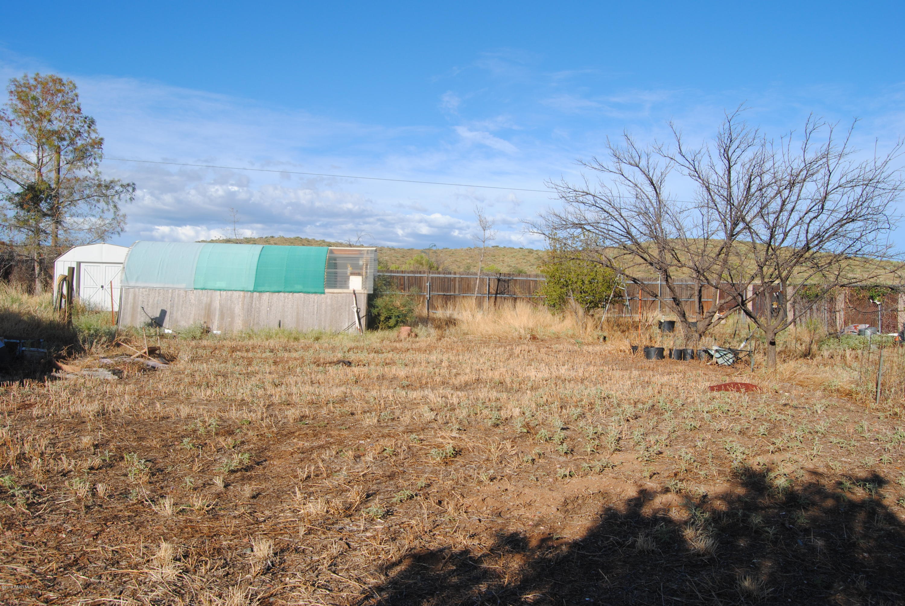 17050 East Spring Valley Road Mayer, AZ 86333 - Photo 5 of 19 005_LookingNorthto GreenhouseShed