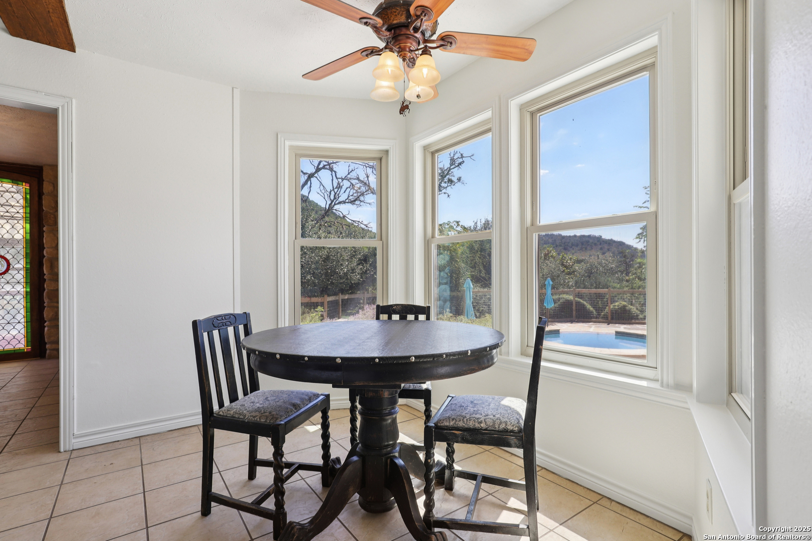 4380 Bear Springs Road Pipe Creek, TX 78063 - Photo 11 of 60 a dining room with furniture and window
