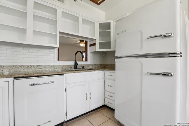 a bathroom with a toilet a sink and a mirror