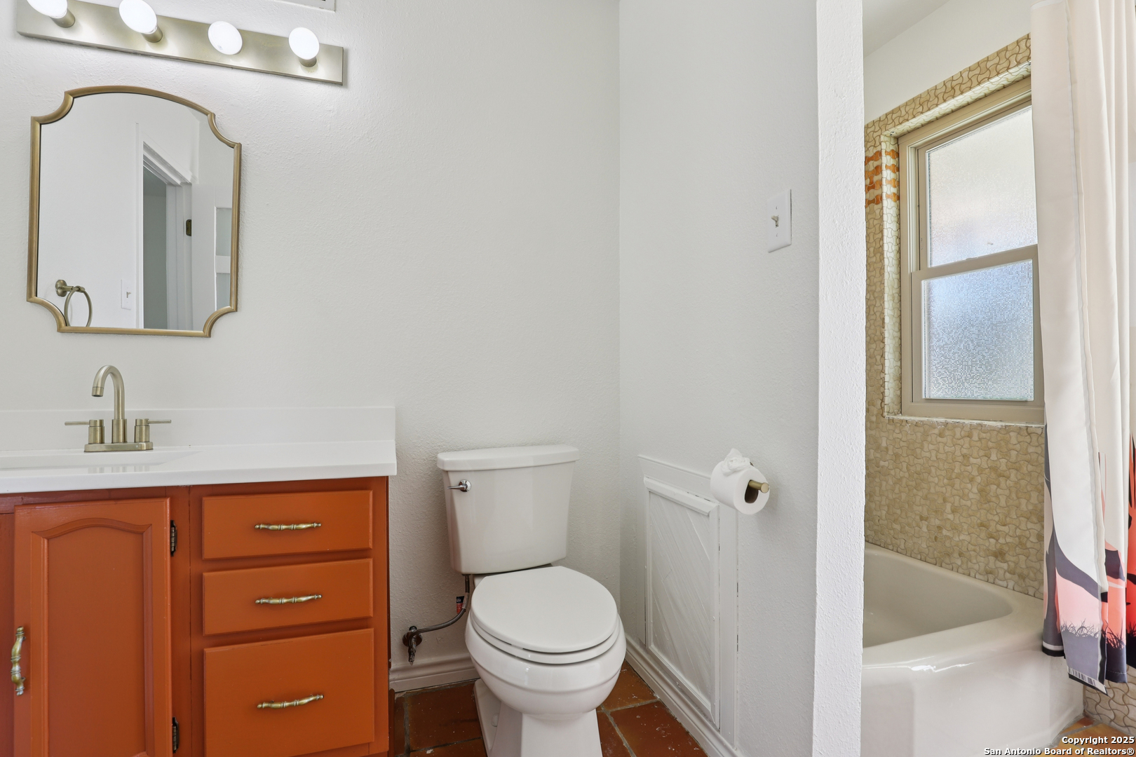 4380 Bear Springs Road Pipe Creek, TX 78063 - Photo 17 of 60 a bathroom with a toilet a sink and a mirror
