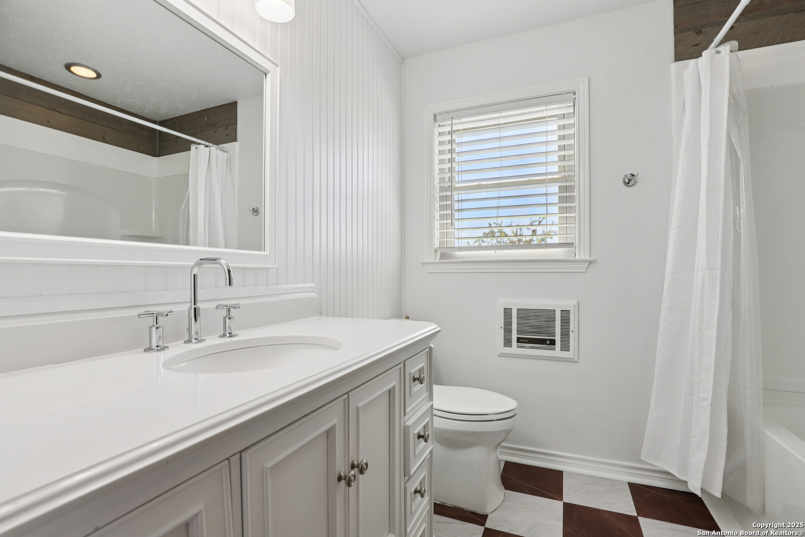 4380 Bear Springs Road Pipe Creek, TX 78063 - Photo 20 of 60 a bathroom with a sink a toilet a shower and a window