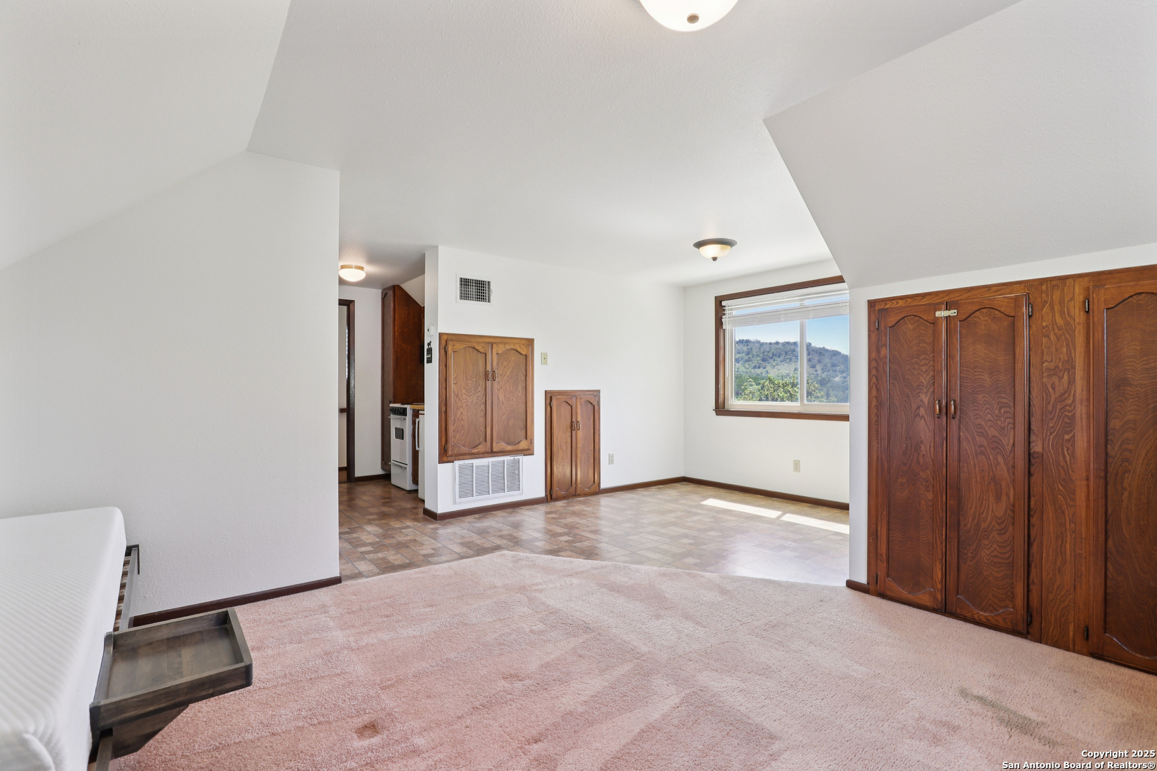 4380 Bear Springs Road Pipe Creek, TX 78063 - Photo 27 of 60 an empty room with windows and closet