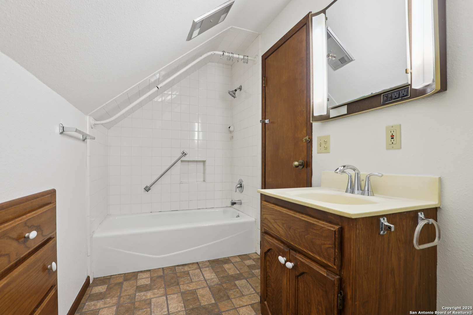 4380 Bear Springs Road Pipe Creek, TX 78063 - Photo 29 of 60 a bathroom with a sink a mirror and a bathtub