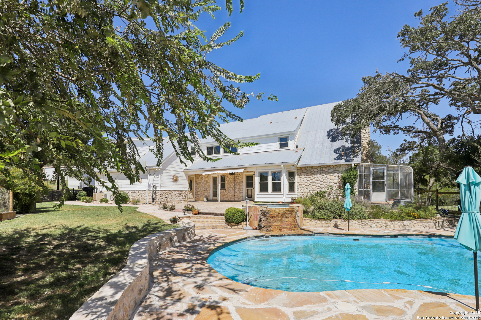 4380 Bear Springs Road Pipe Creek, TX 78063 - Photo 33 of 60 a front view of a house with a yard