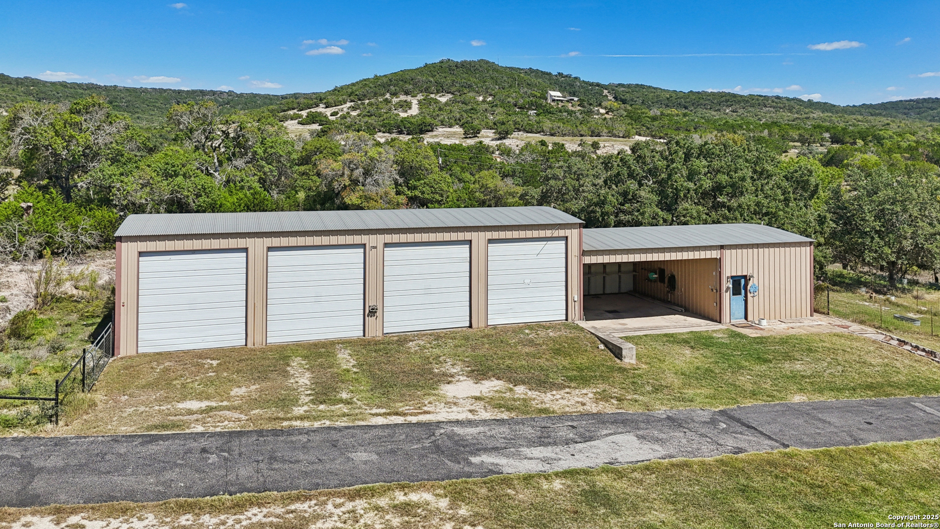 4380 Bear Springs Road Pipe Creek, TX 78063 - Photo 35 of 60 a view of a house with a yard