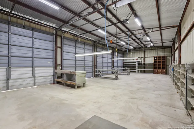 a view of an empty room with wooden walls