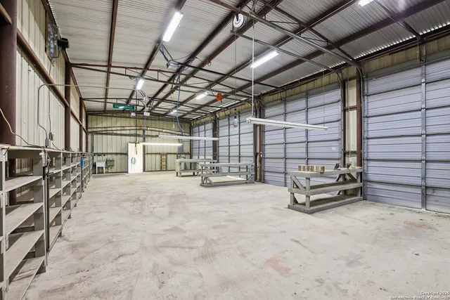 a view of a small house in the middle of a yard