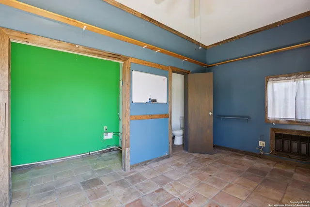 a view of a wooden door and a yard