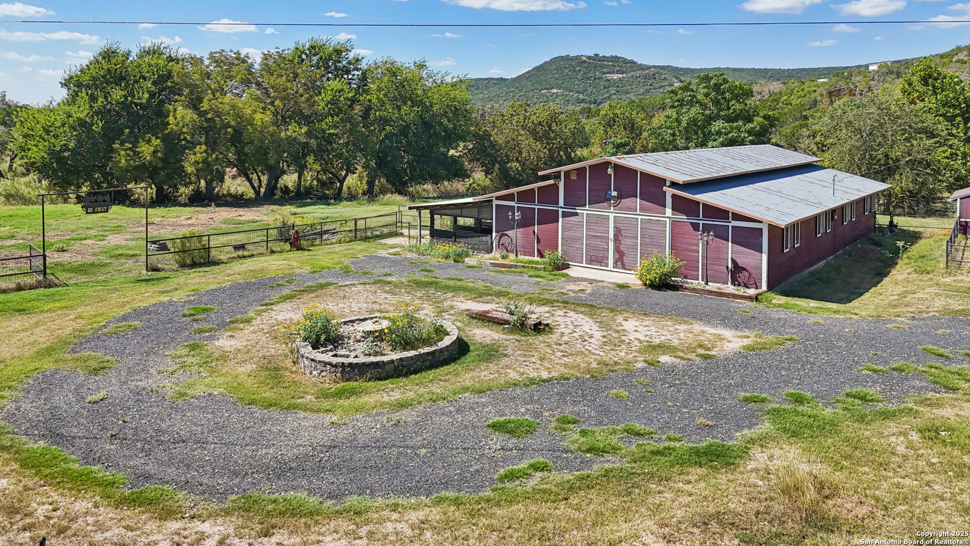 4380 Bear Springs Road Pipe Creek, TX 78063 - Photo 40 of 60 a view of a house with a yard