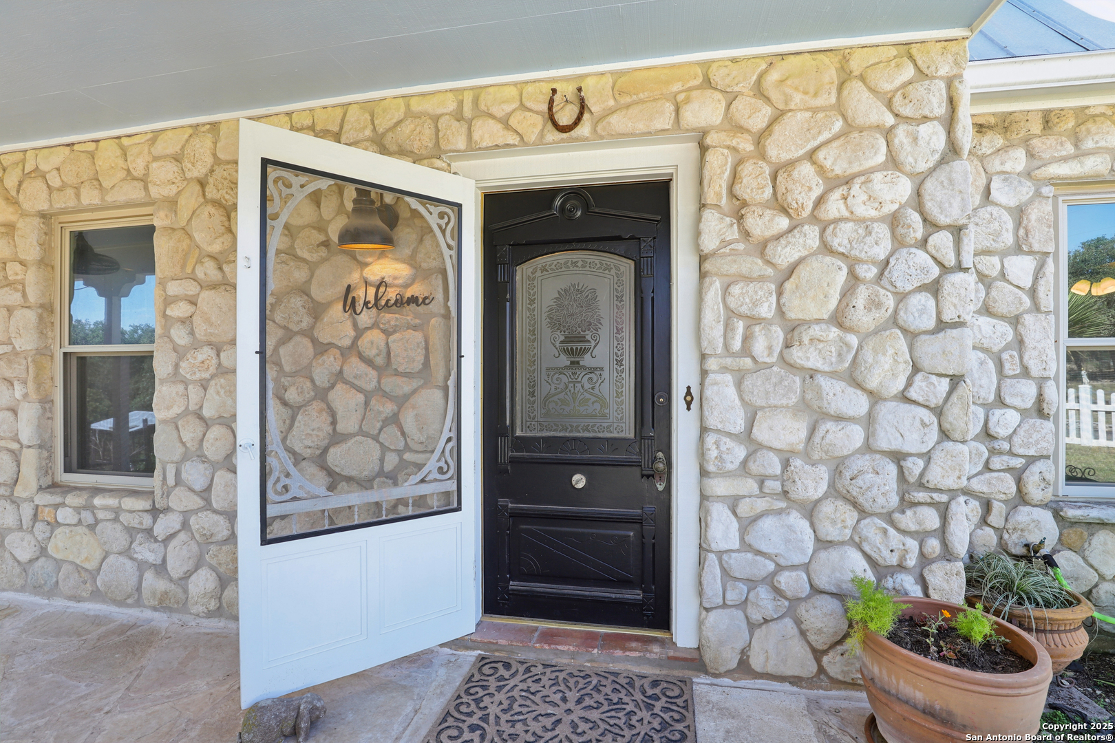4380 Bear Springs Road Pipe Creek, TX 78063 - Photo 4 of 60 a bathroom with a sink and a mirror