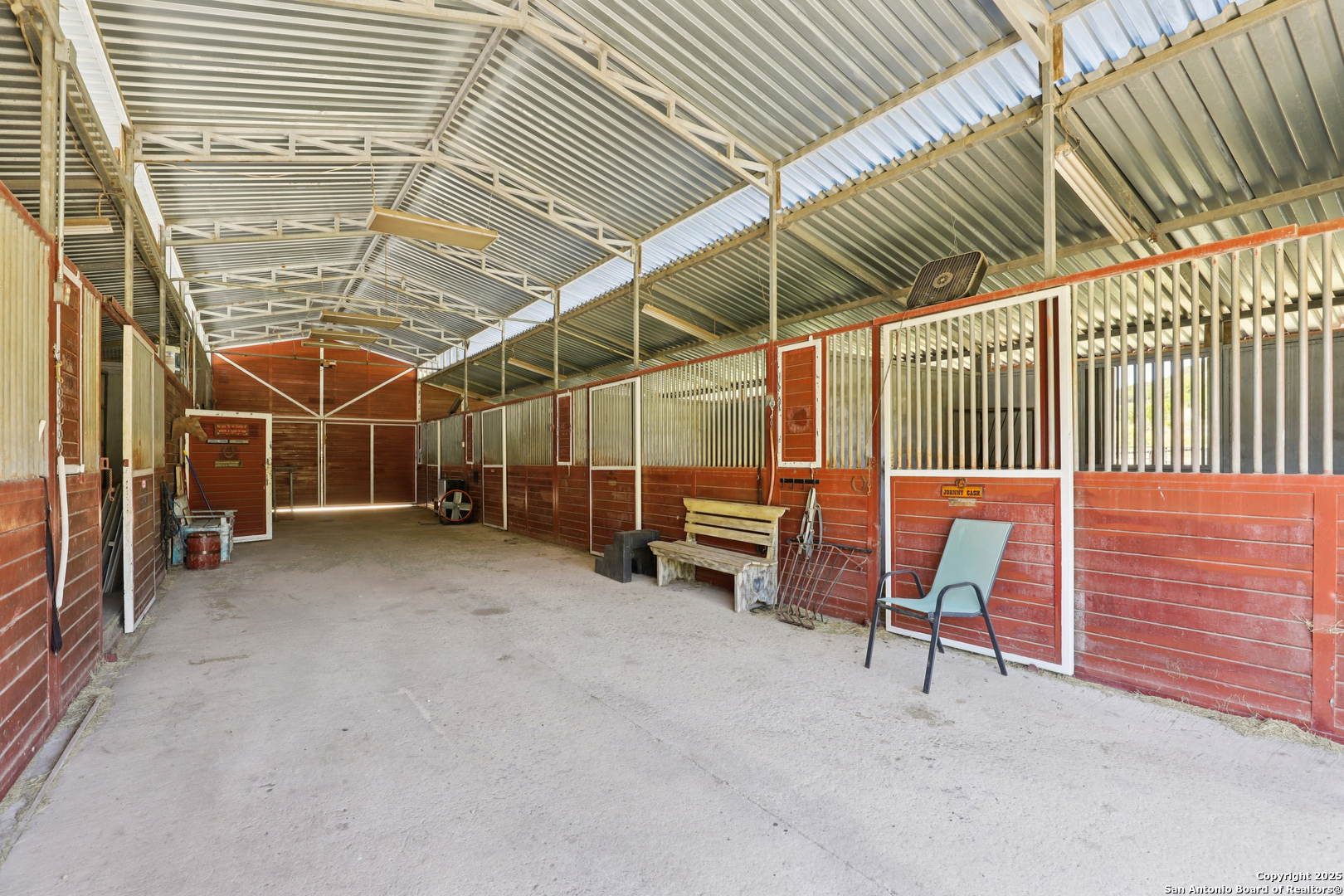 4380 Bear Springs Road Pipe Creek, TX 78063 - Photo 42 of 60 a view of an empty room with wooden walls