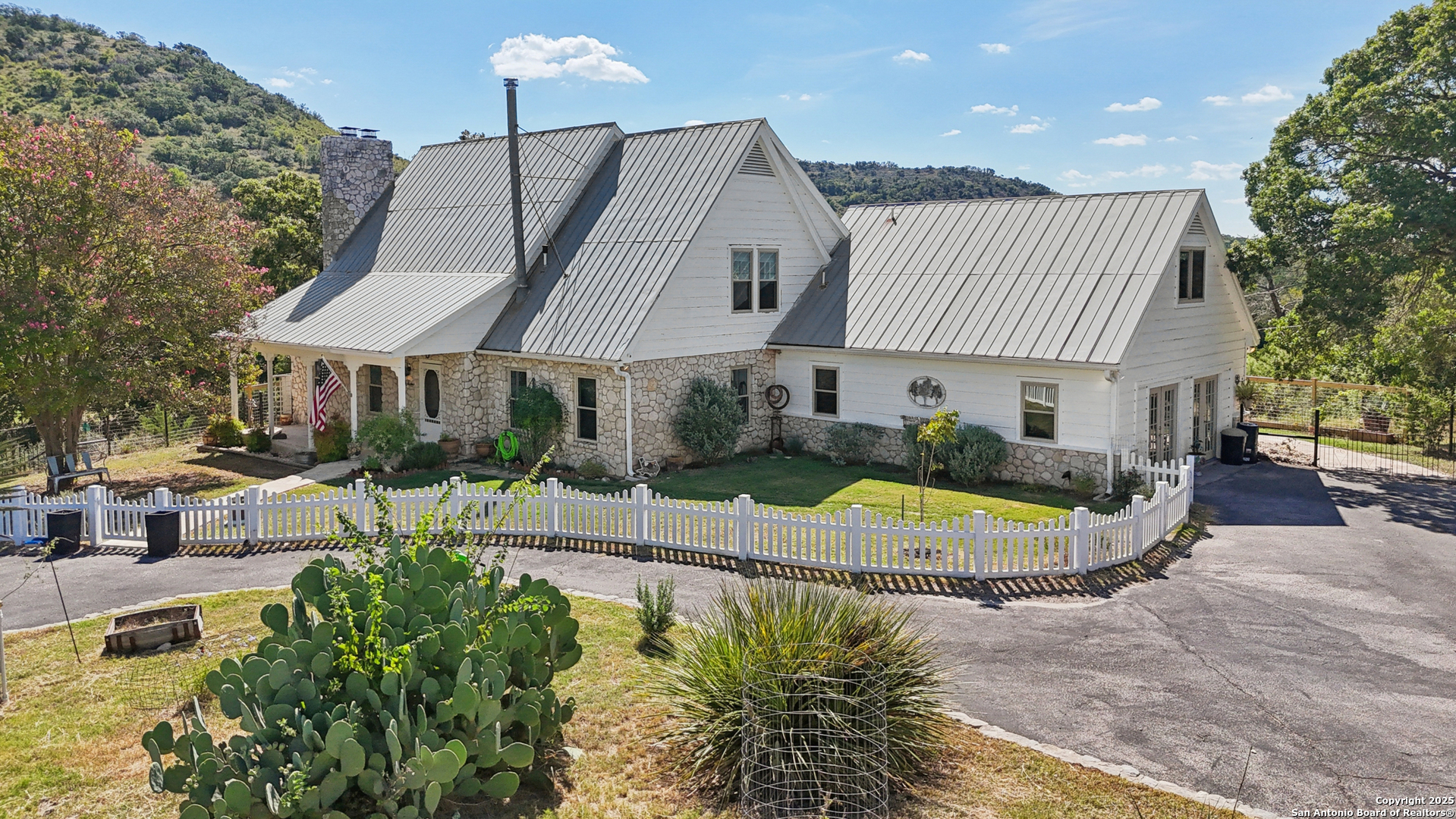 4380 Bear Springs Road Pipe Creek, TX 78063 - Photo 45 of 60 a view of a house with swimming pool and sitting area