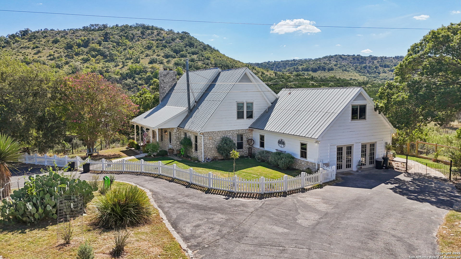 4380 Bear Springs Road Pipe Creek, TX 78063 - Photo 46 of 60 a view of a house with swimming pool and porch