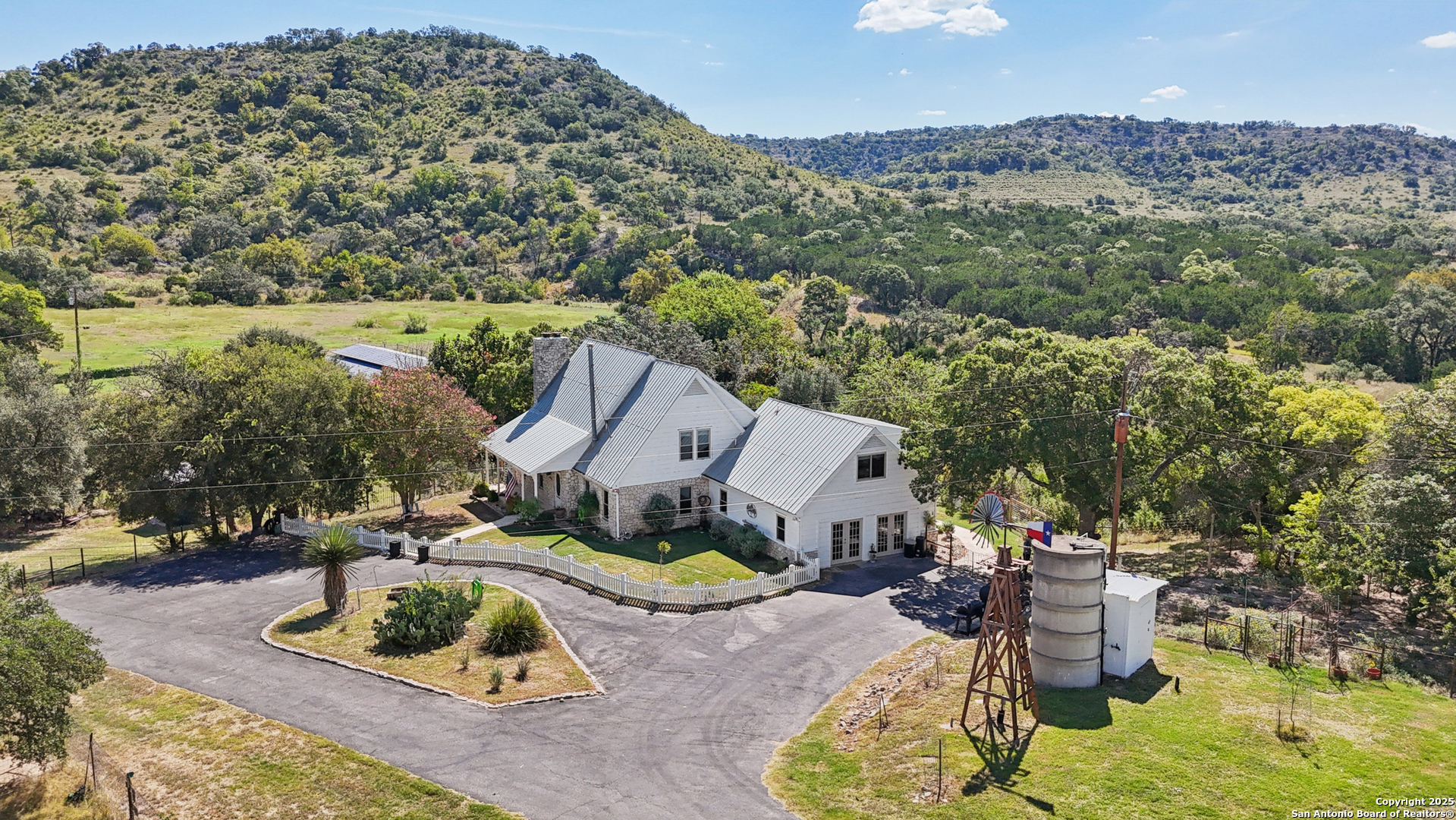 4380 Bear Springs Road Pipe Creek, TX 78063 - Photo 47 of 60 an aerial view of a house with a yard