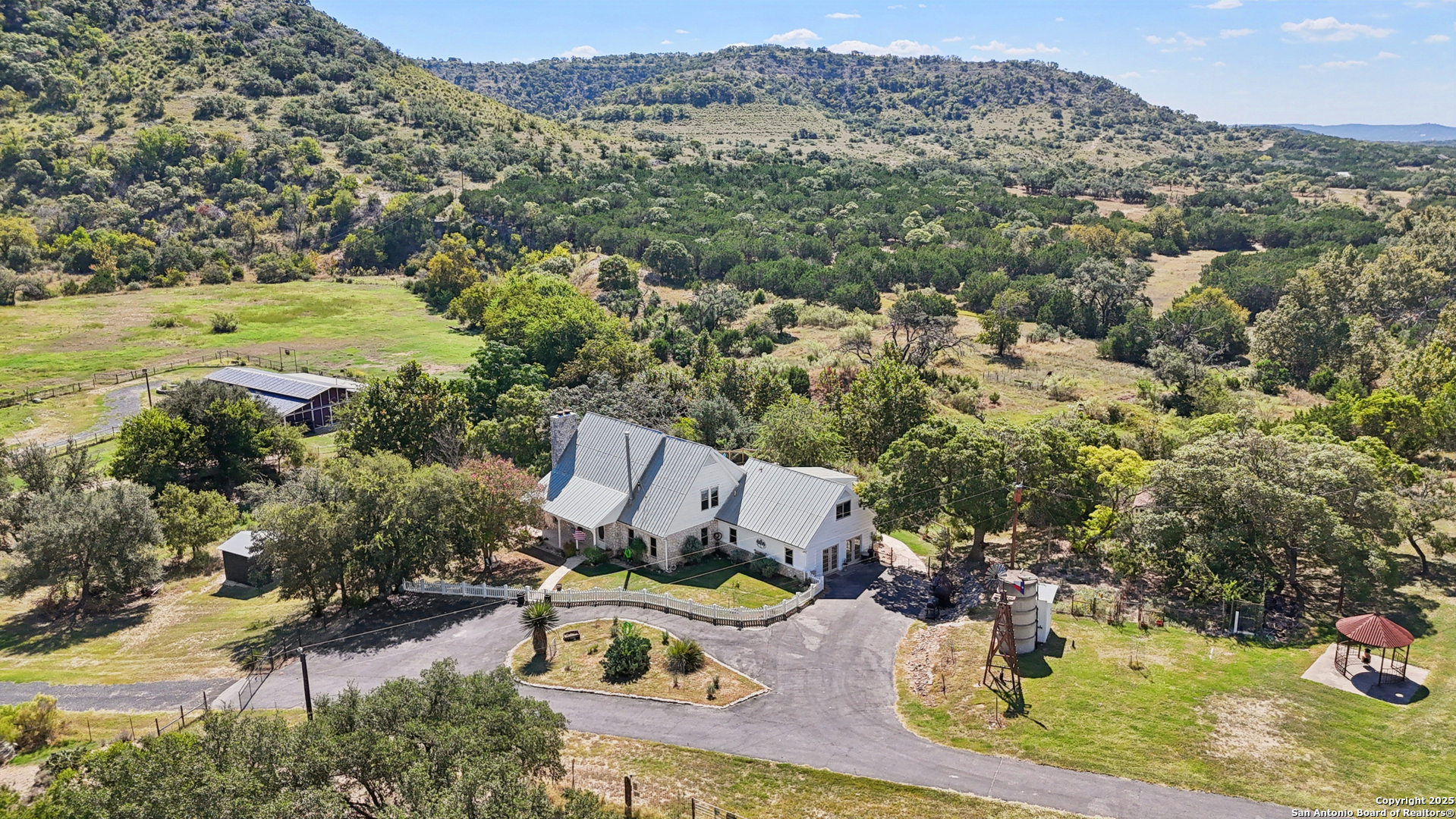 4380 Bear Springs Road Pipe Creek, TX 78063 - Photo 48 of 60 an aerial view of a house with a yard