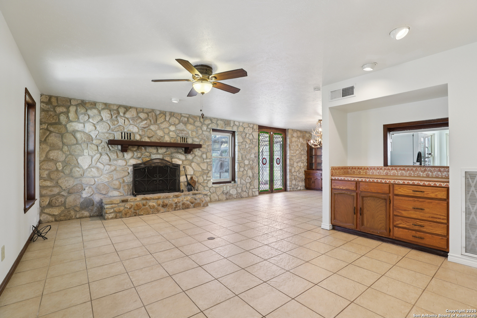4380 Bear Springs Road Pipe Creek, TX 78063 - Photo 6 of 60 a view of an empty room and a kitchen