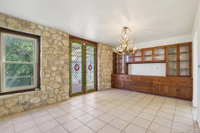 a view of a wooden bench and next to a window